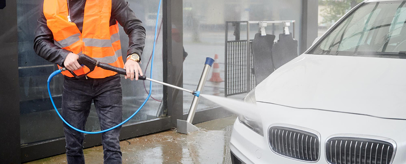 drive in hand car wash service in Melbourne with professionals cleaning vehicle efficiently for busy customers