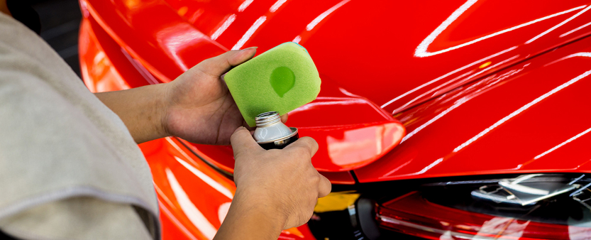 Paint protection film installation on car bumper to prevent scratches and chips