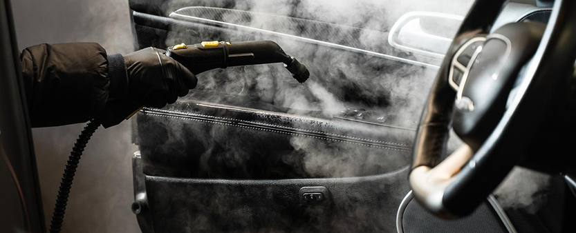 Professional steam cleaning removing allergens from car interior in Melbourne